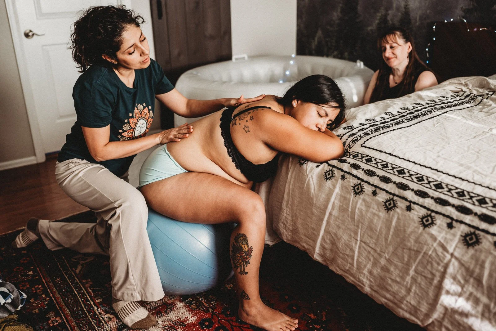 Maribel offering counter-pressure to a laboring mother
